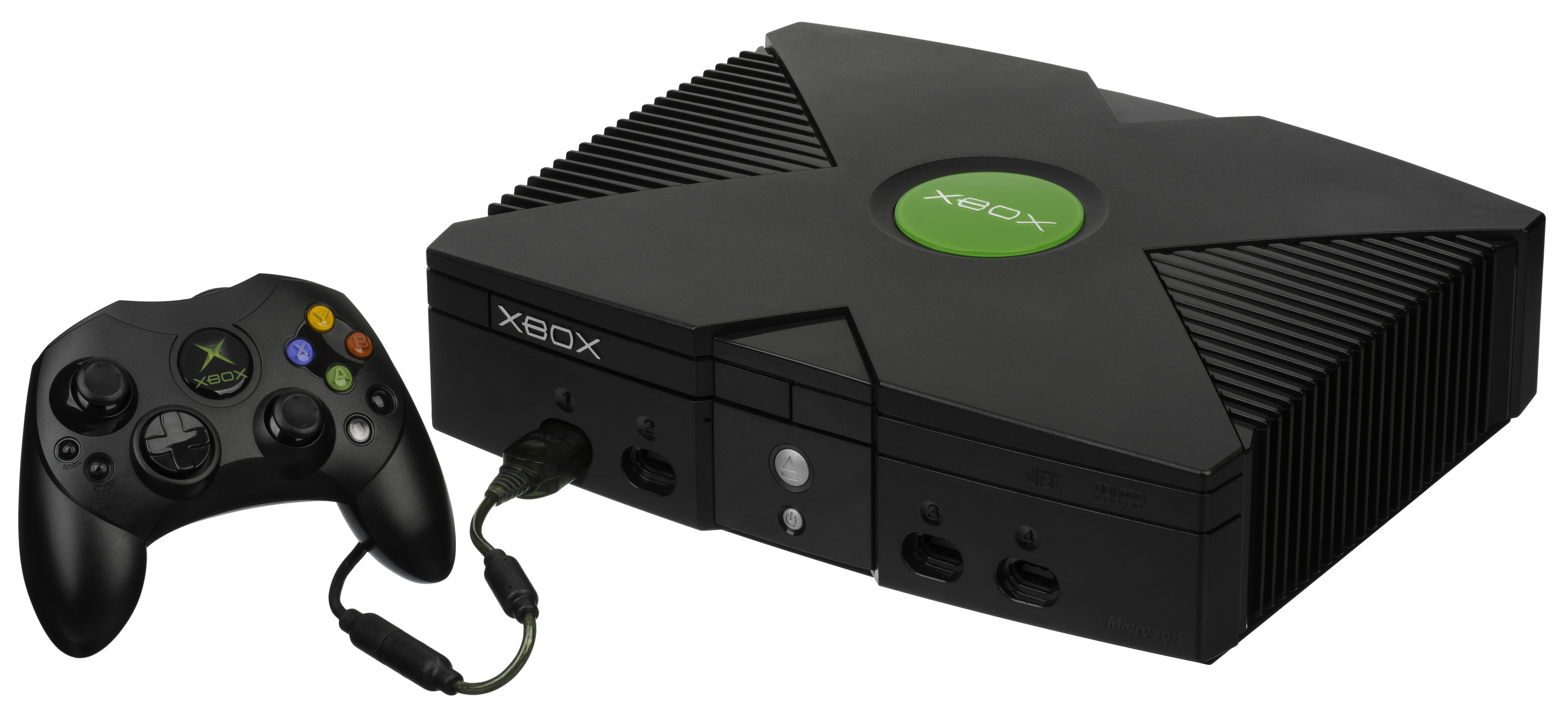 xbox original console with a controller for the system to the left