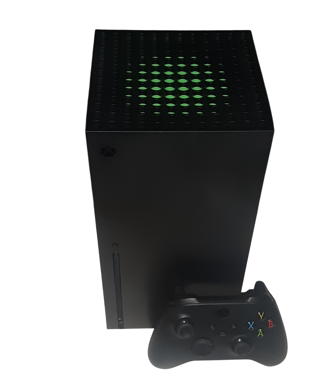 xbox series x console with the controller for the system in front